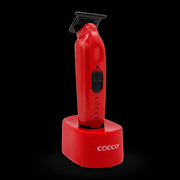 Red grooming tool with 'Cocco' branding on a black background