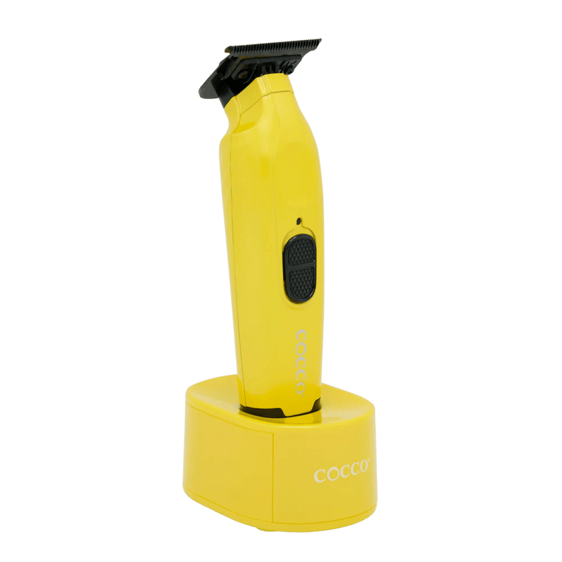 Yellow grooming clipper with black accents on a clear background
