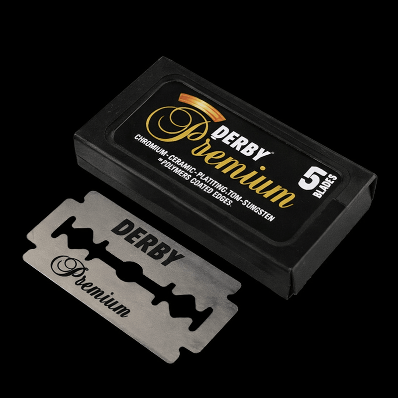 Derby Premium razor blades with packaging on a black background