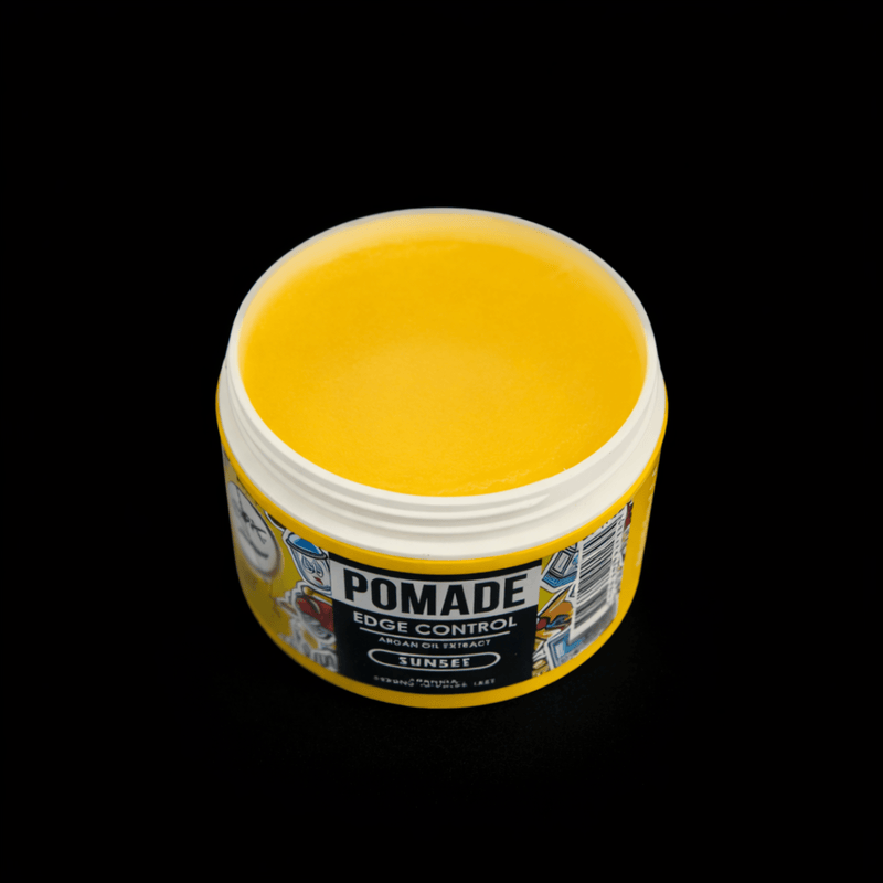 Jar of pomade showing the yellow jelly pomade on a black background