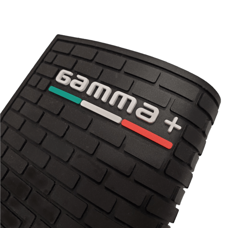 Close-up of a black textured product with 'gamma+' branding on a clear background