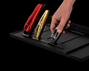 Gamma+ magnetic barber station mat holding cordless clippers and trimmers