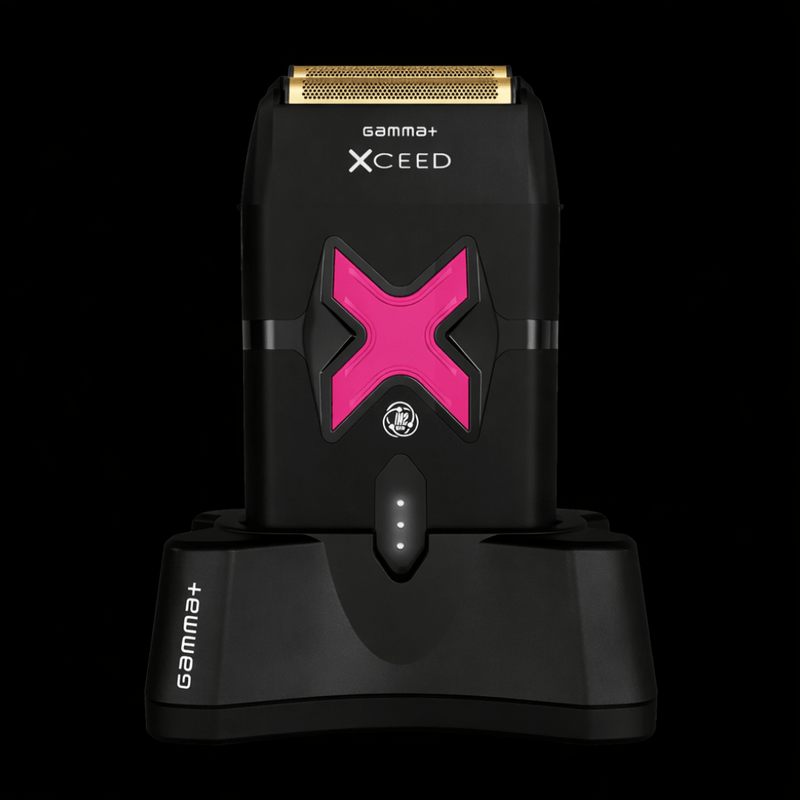 Black electric shaver with pink 'X' design on a black background