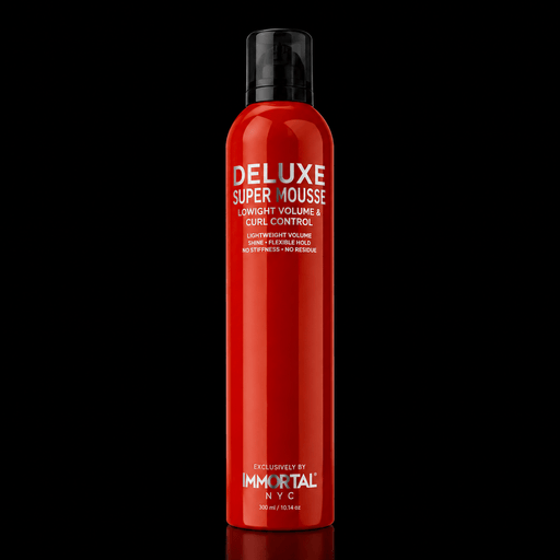 Immortal NYC Delux Super Mousse – front view, red bottle on black background