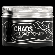 Immortal NYC Chaos Sea Salt Pomade jar with silver lid, close-up on black background