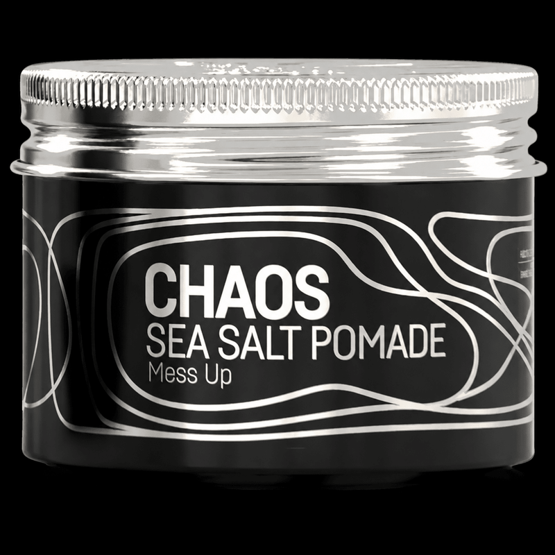 Immortal NYC Chaos Sea Salt Pomade jar with silver lid, close-up on black background