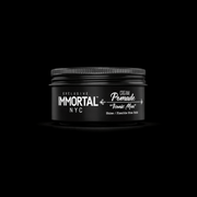 Black jar of Immortal NYC cream pomade on a black background