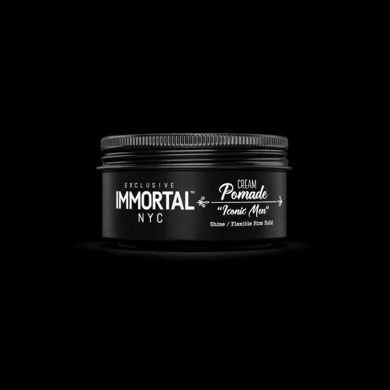 Black jar of Immortal NYC cream pomade on a black background