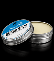 Johnny B Beard Balm – open tin with balm visible on black background