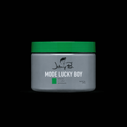 Johnny B Mode Lucky Boy Gel – gray jar with green lid on black background