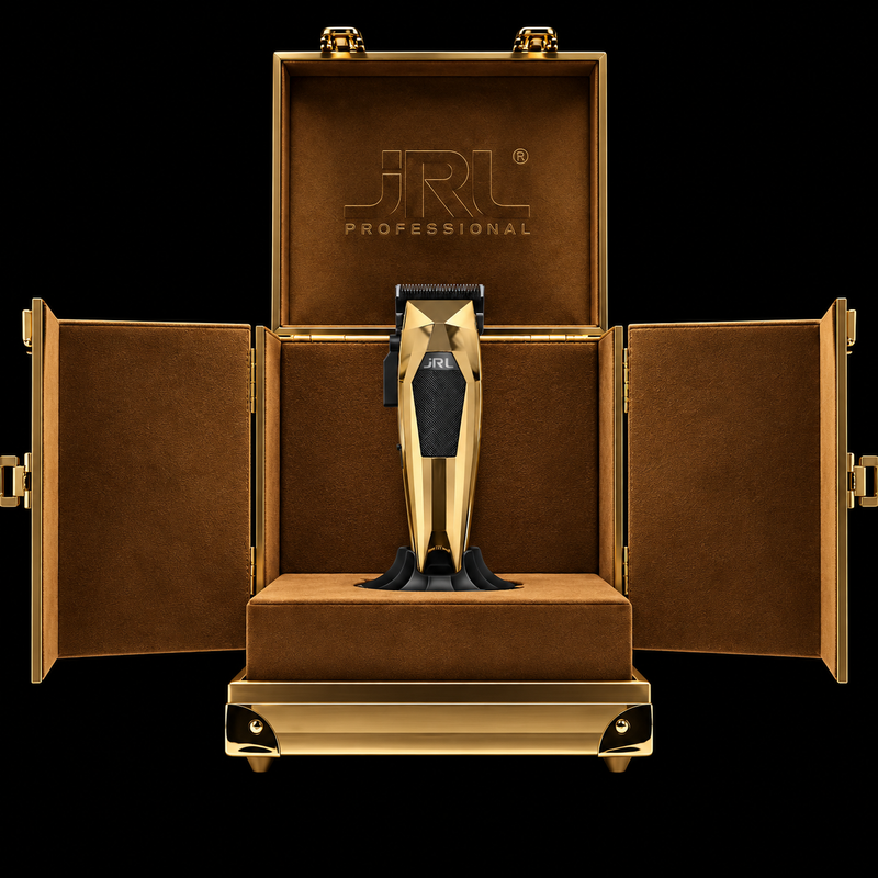 JRL 3000C Gold Collector's Edition clipper displayed on a pedestal inside its open gold presentation case