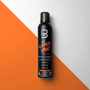 Black bottle of 5-in-1 clipper spray on a white and orange background