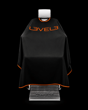Black barber cape with 'LEVEL3' branding on a black background