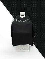 L3VEL3 Barber Cape Black with White Trim – on stand