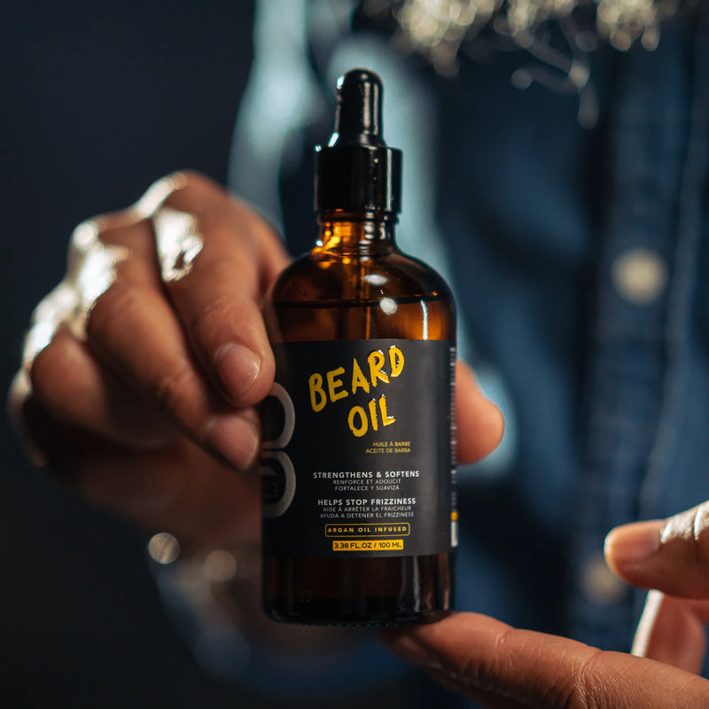 L3VEL3 beard oil bottle held in hand showing size and usage for beard care