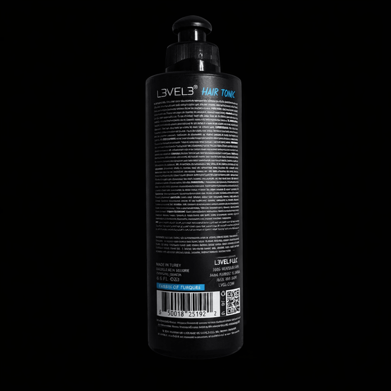 Black bottle of L'VEL3 hair tonic on a black background