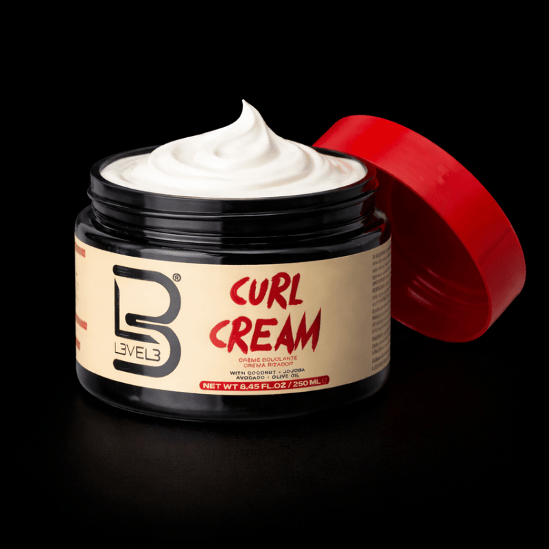 Jar of L3VEL3 Curl Cream open red lid showing cream on a black background