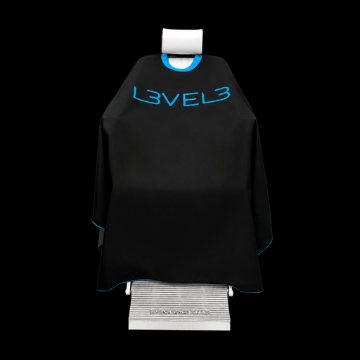 L3VEL3 Professional Rubber Neck Cutting Cape in black with blue trim, draped over a barber chair