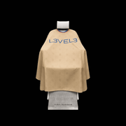 L3VEL3 Professional Rubber Neck Cutting Cape in beige with red trim