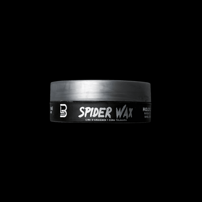 Jar of Spider Wax with grey lid on a black background