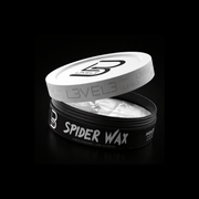 Spider Wax container with silver lid open on a black background
