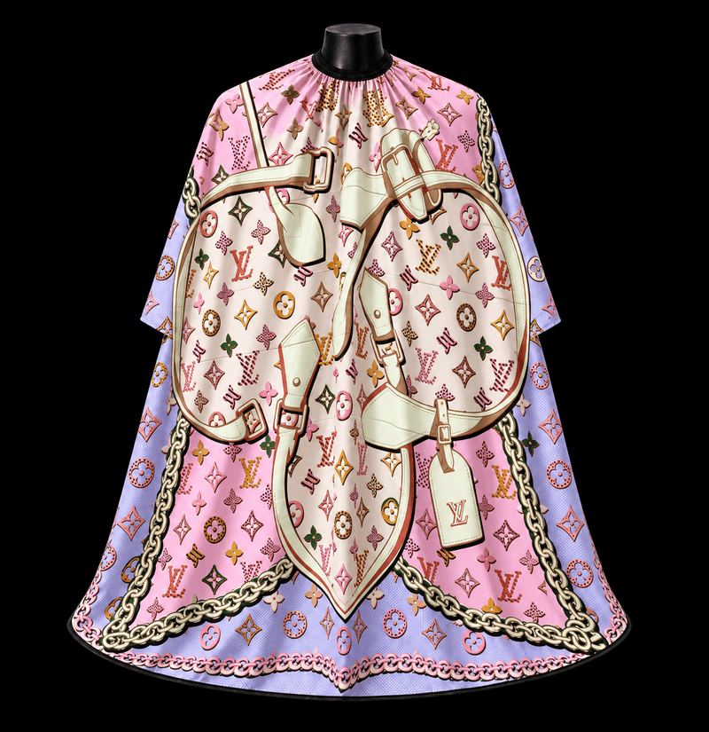 Pink LV Barber Cape - front-facing view showing the all-over pink monogram print with an illustrated luggage graphic and gold chain border on a lightweight water-resistant polyester cape