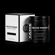 Tame Deluxe Pomade jar and box on a black background