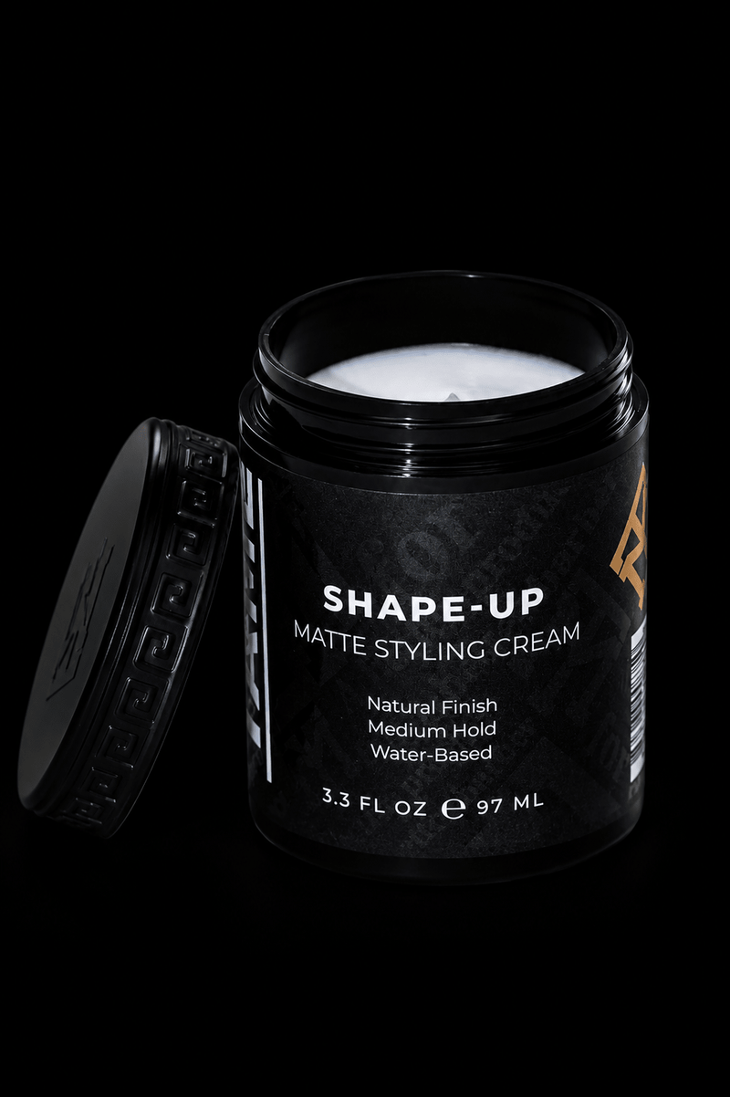 Black jar of 'Shape-Up' matte styling cream on a black background