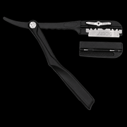 Black straight razor with additional components on a white background