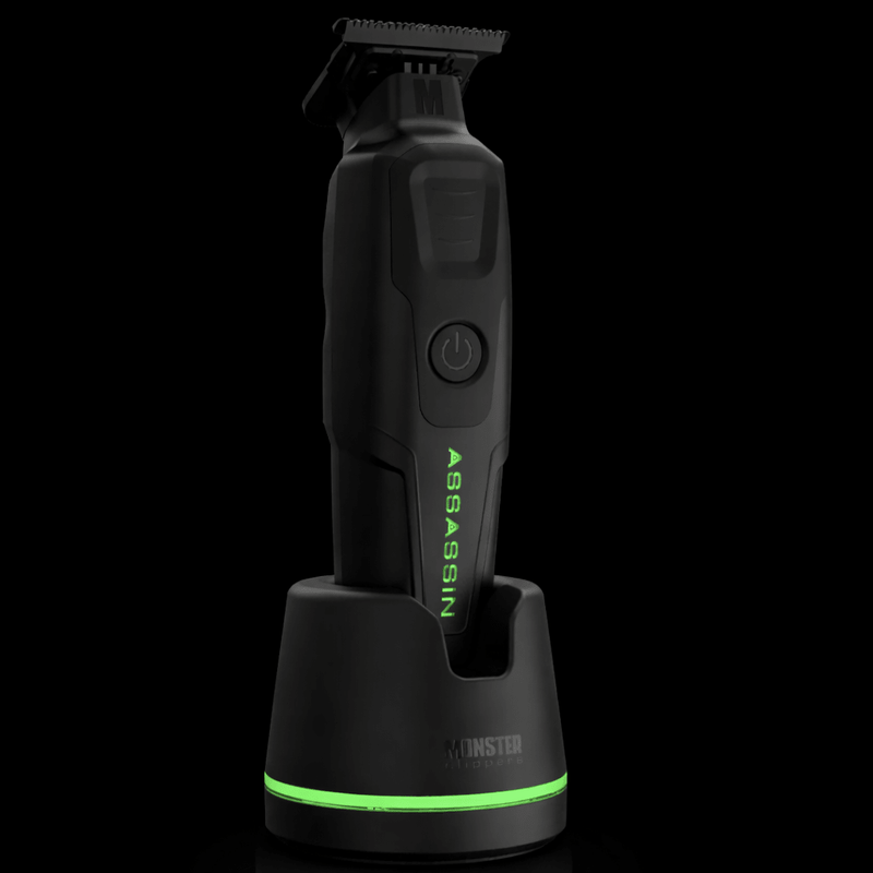 Monster Assassin trimmer sitting in charging dock with green LED base light