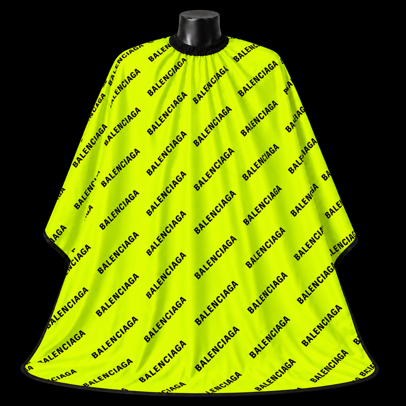 Neon Green Balenciaga Barber Cape - front-facing view showing the all-over black logo lettering print on a neon green lightweight water-resistant polyester cape