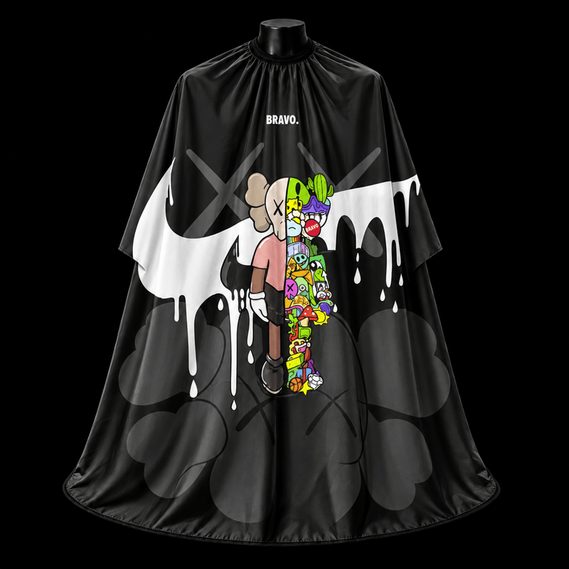 Nike KAWS Barber Cape - front-facing view showing the black drip graphic, KAWS-style character with X eyes, and colorful doodle art on a lightweight water-resistant polyester cape