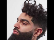 Professional barber using L3VEL3 Milly Clutch razor holder for beard detailing and line work