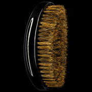Side view of RED by KISS BR14 curved medium soft boar bristle palm wave brush