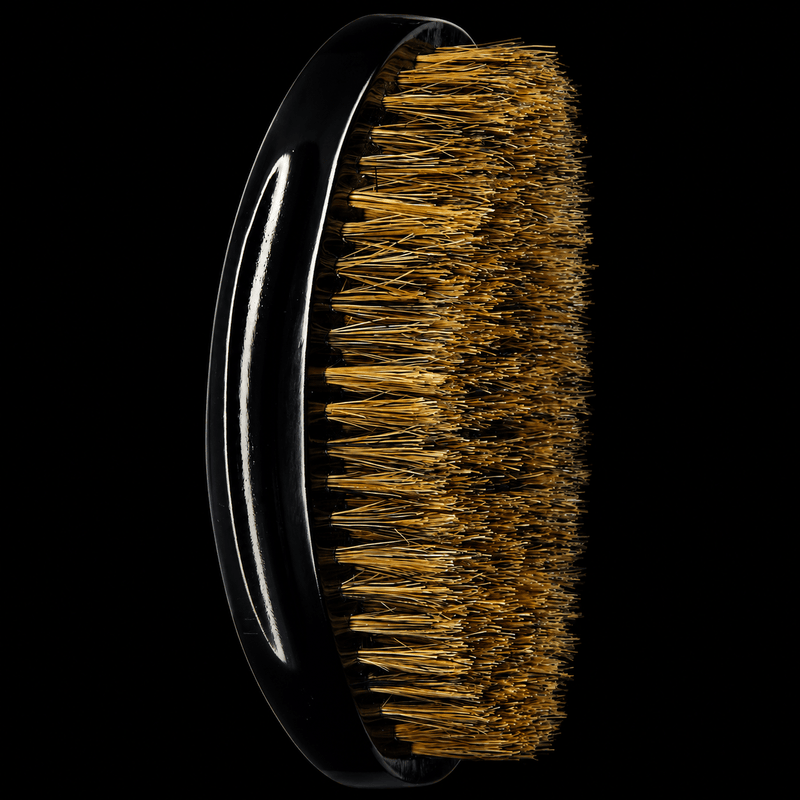 Side view of RED by KISS BR14 curved medium soft boar bristle palm wave brush