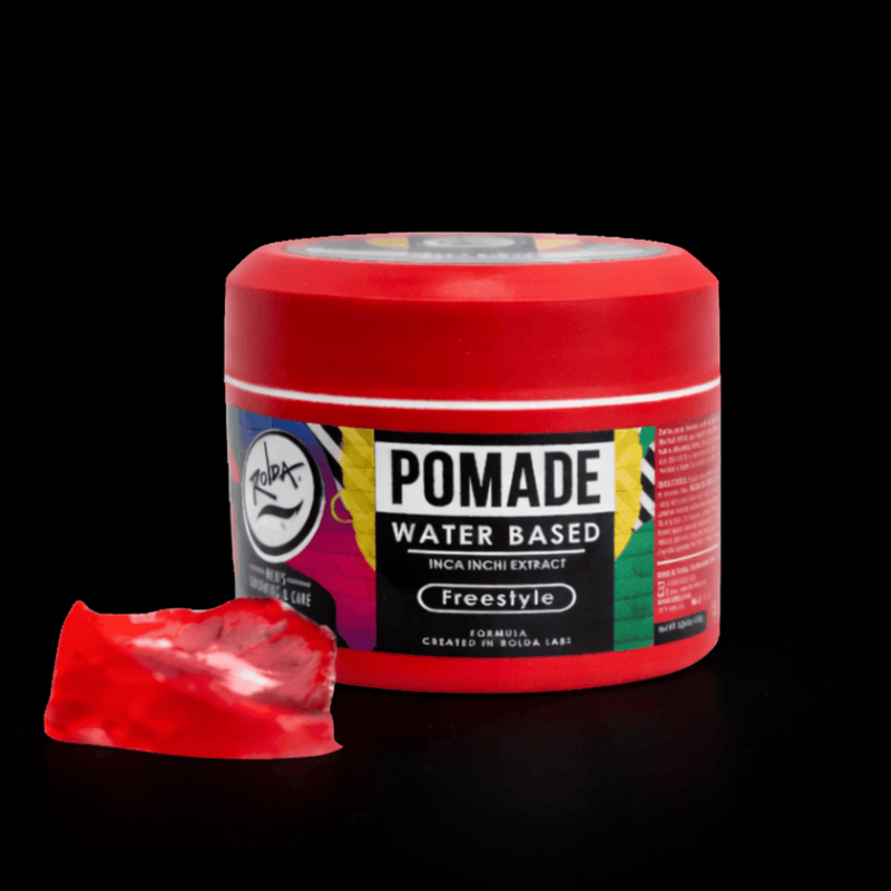 Red water-based pomade jar with a small amount of red pomade on the side on a black background