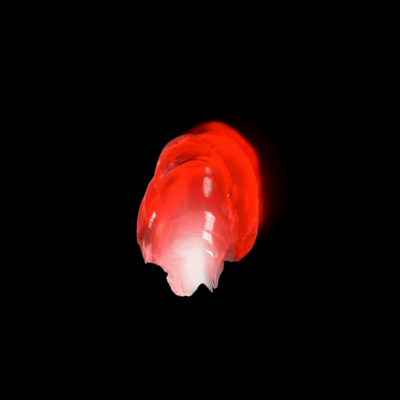 Red jelly like smear on a black background