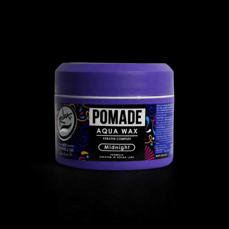 Purple jar of pomade with a black label on a black backgroundPrimosBarberSupply