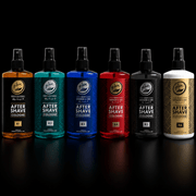 Set of six bottles of after-shave and cologne on a black background