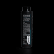 Black bottle with text and a barcode on a black background