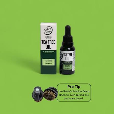 Rolda Tea Tree Beard Oil 30ml box and bottle on green with a pro tip to spread the oil using the Rolda Knuckle Beard Brush