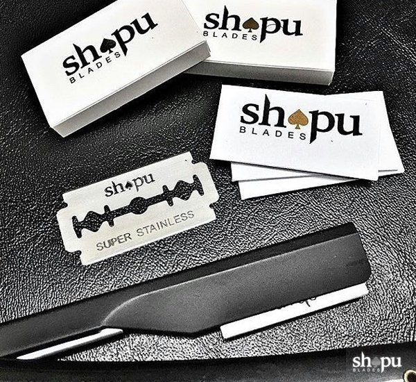 Shapu double edge razor blades with packaging and blades displayed on countertop