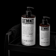 STMNT All In One Cleanser product display with multiple bottles