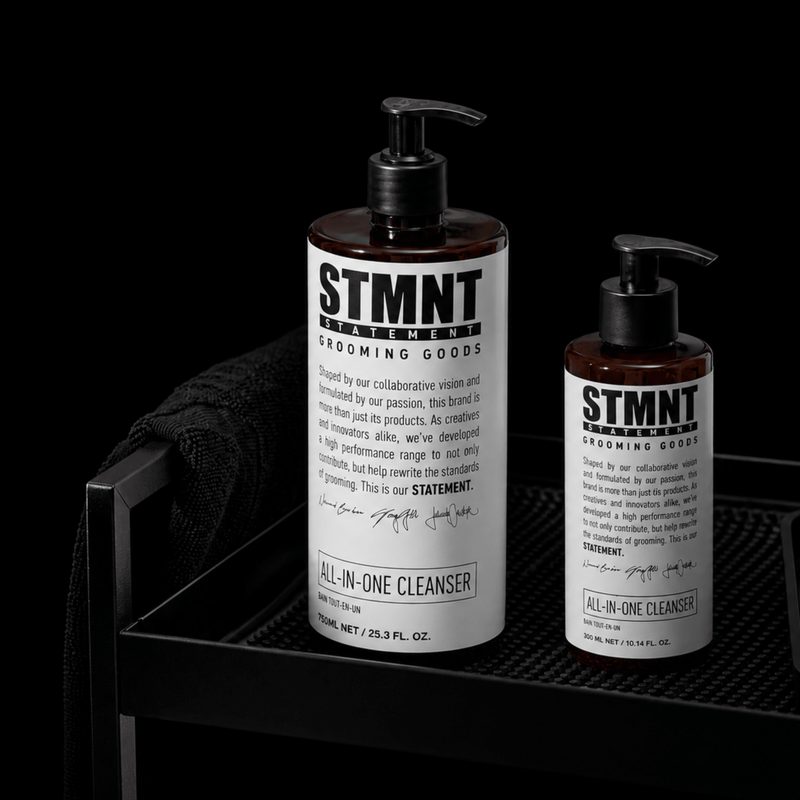 STMNT All In One Cleanser product display with multiple bottles