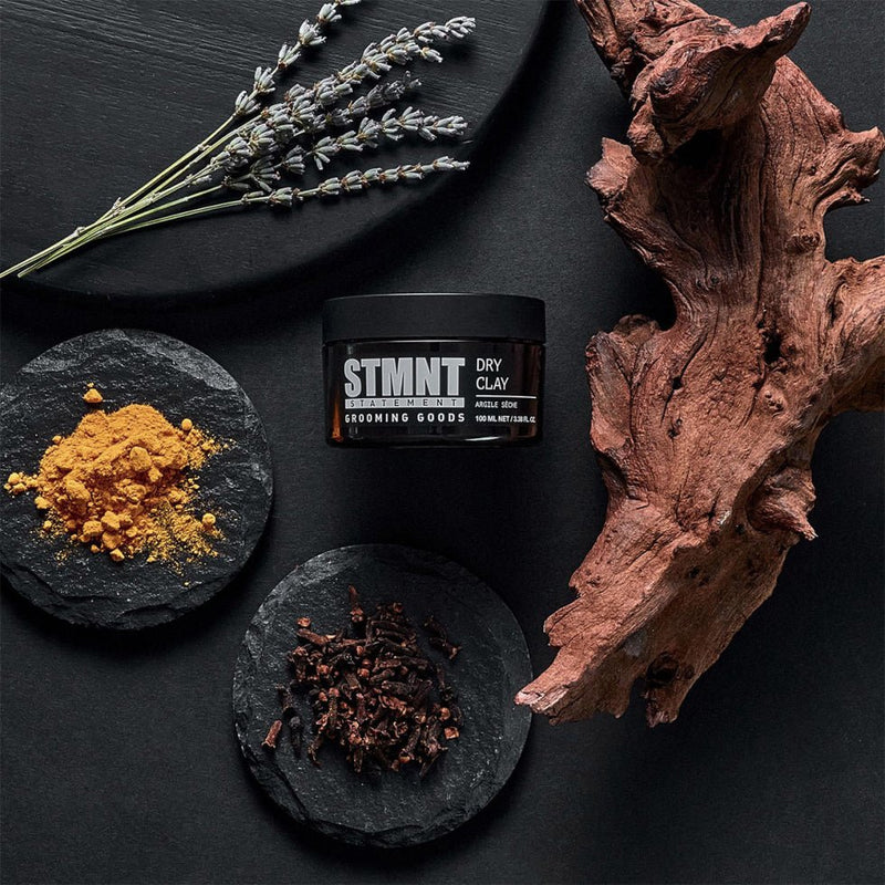 STMNT Grooming Goods Dry Clay styling clay with matte texture and barber grooming aesthetic