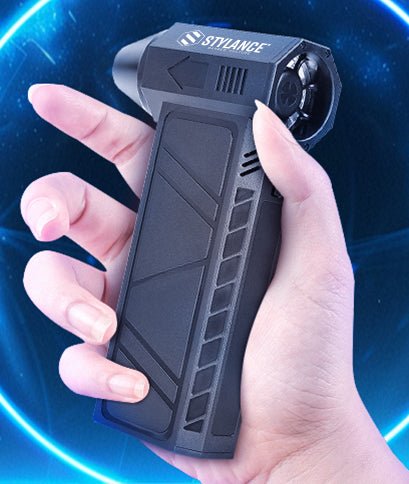 Hand holding the STYLANCE Mini Hair Air Duster, showing how it fits in one palm