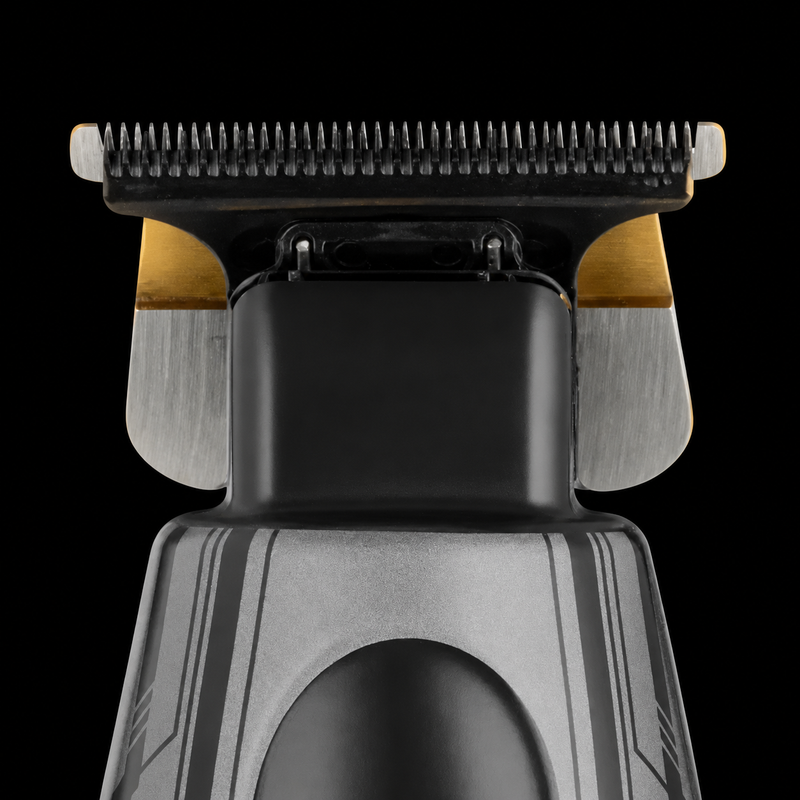 Close-up of the StyleCraft x 3Versince trimmer blade head, gold titanium fixed blade and black cutter on a black background