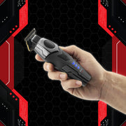Hand holding the StyleCraft x 3Versince Professional Hair Trimmer against a black and red background