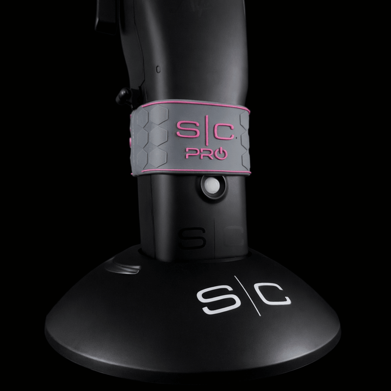 Low angle of black trimmer with 'SC' branding grip on a black background