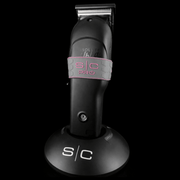Hair trimmer with 's/c' grey and pink grip on a black background
